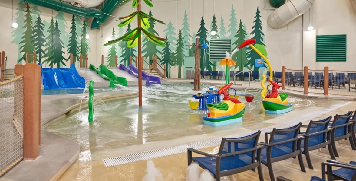mother and child enjoying in a kidee pool in waterpark