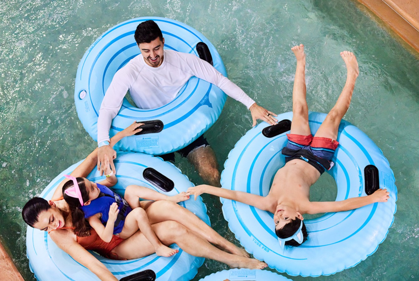 Family enjoying a lazy river ride at Great Wolf Lodge